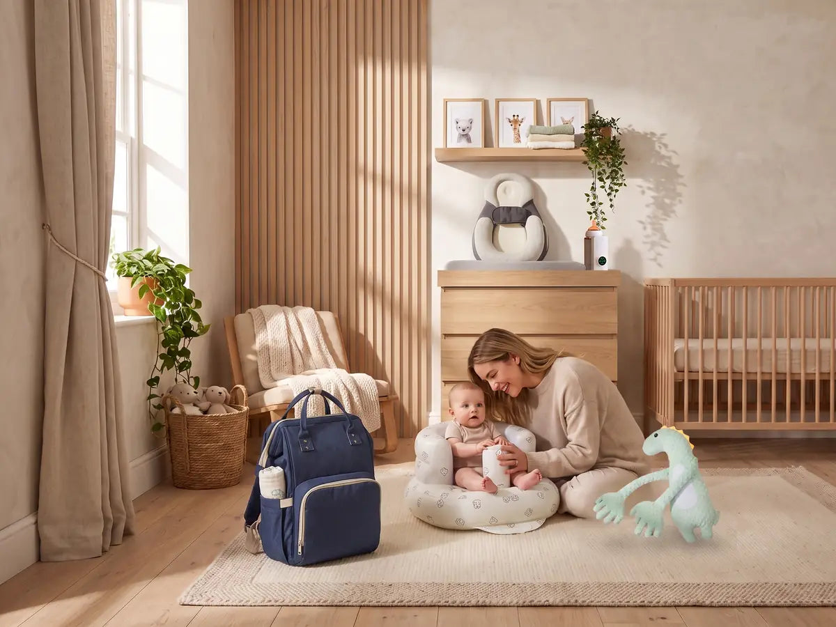 A nursery with the changing bag, bottle warmer and stroller, mother and baby on the rug